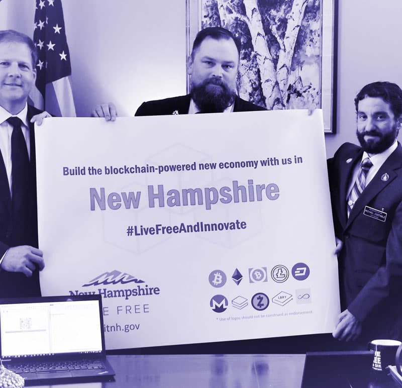 NHBC team members holding a blockchain innovation sign